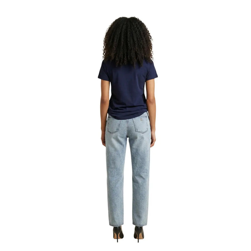 A pair of light-wash denim jeans with a straight-leg cut and classic back pockets shown from the back side