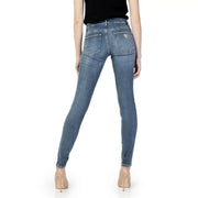 Back side of guess women blue slim fit denim jeans with subtle fading from fall winter collection showing logo pocket