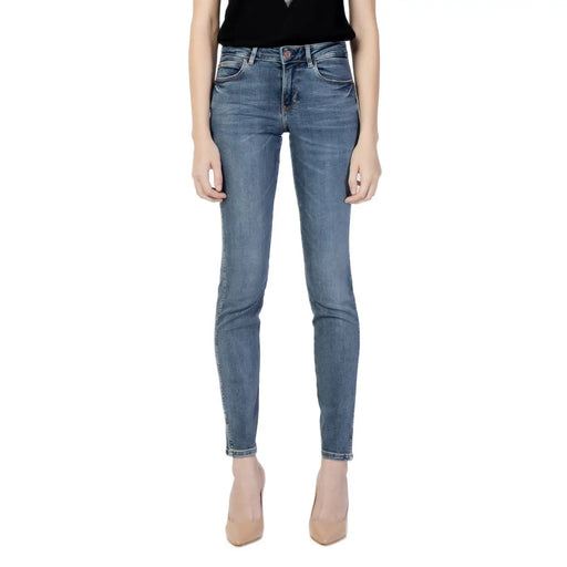 Guess women blue high waisted slim fit denim jeans with five pocket design and subtle fading from fall winter collection