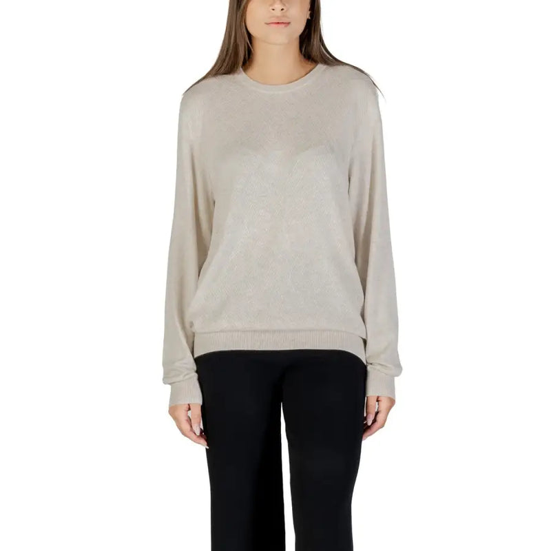 Woman wearing Guess Women Fall Winter Beige Round Neck Knit Sweater and black pants