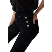 Schwarze Baumwolle Guess Die neue Damenhose „Faye“ besticht durch ihren hohen Bund und drei silberfarbene Knöpfe vorne.