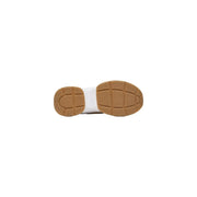 Tan rubber sole with white midsole and textured grip on guess women slip on beige polyester blend sneakers