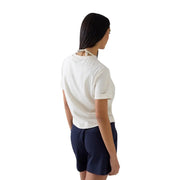 Guess women white cotton short sleeve t shirt with round neck and tie-back neckline shown from the back side