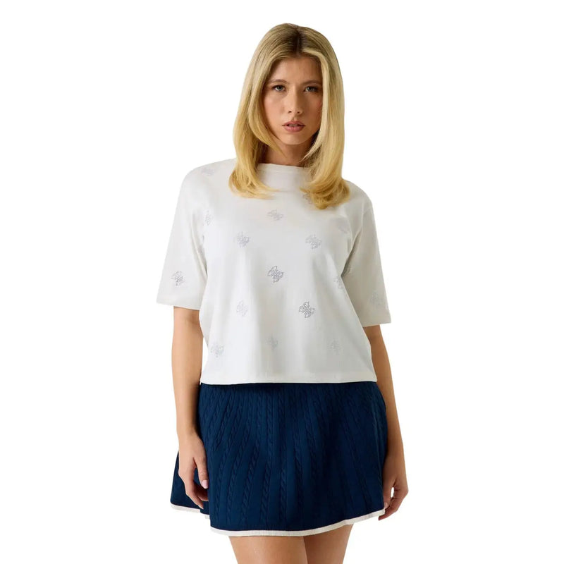 Guess women white cotton rhinestone silvy t shirt with subtle silver embroidery paired with navy blue cable knit skirt