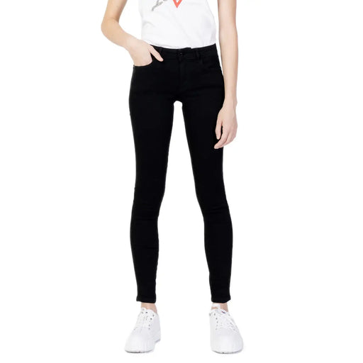 Guess women’s black skinny jeans with classic five-pocket design and subtle stitching details
