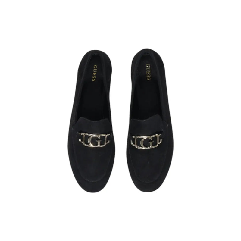Guess women’s black leather moccasin flats featuring black suede loafers with a silver-toned g logo buckle