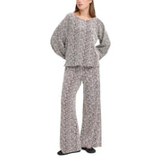A matching two-piece loungewear set in soft flowing fabric with abstract black and white wavy pattern from ichi women brown print trousers fall winter collection