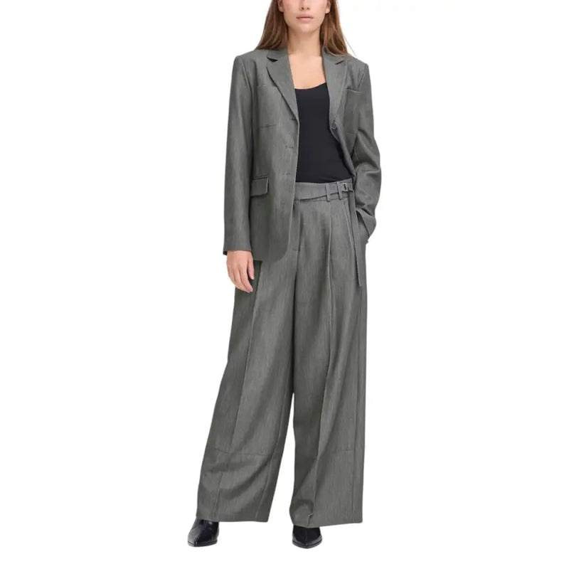 A tailored gray blazer with subtle striped texture and structured shoulders paired with ichi women’s grey trousers