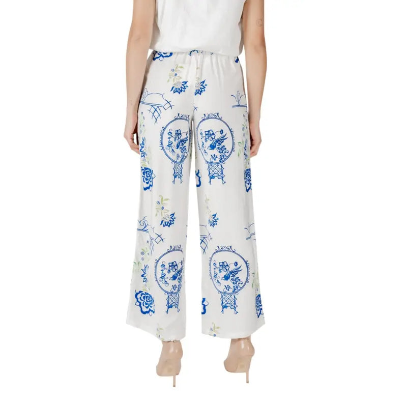 Ichi women’s white wide-leg trousers with blue and green porcelain-inspired circular pattern and lace details