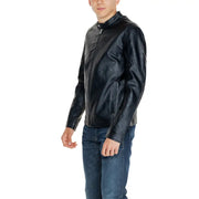 Young person modeling Jack & Jones Black Long Zip Blazer with biker jacket style and blue jeans