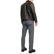 Black leather biker jacket with sleeve and back zippers shown from the back paired with jack and jones grey cotton stretch trousers for men fall winter