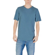 Man wearing blue T-shirt and jeans, featuring Jack & Jones Grey Round Neck Men’s T-Shirt
