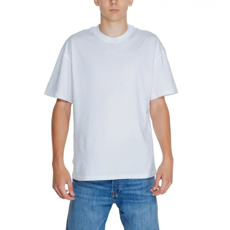 Young man wearing Jack & Jones white short sleeve round neck T shirt and blue jeans