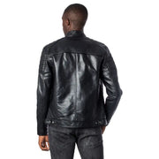 Men’s black faux leather biker jacket with ribbed details paired with dark wash jeans