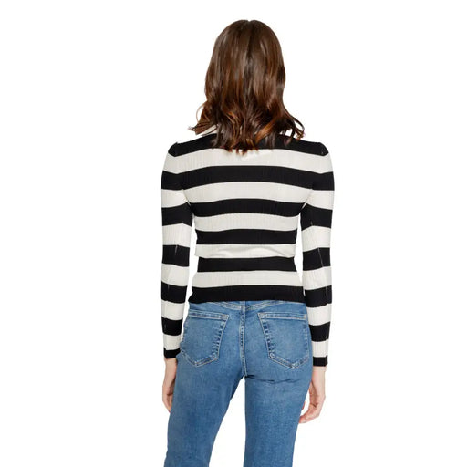 Jacqueline de yong black and white striped ribbed knit long sleeve top in a horizontal pattern