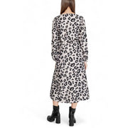 A woman wears a jacqueline de yong grey leopard long sleeve v neck knee-length dress with black and beige print