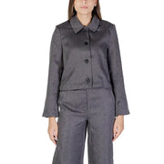 A tailored gray herringbone polyester blazer for women with a classic collar and black buttons by Jacqueline De Yong
