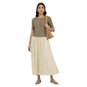 Beige woven mesh shoulder bag with natural textured weave and simple top handle shown alongside jacqueline de yong beige cotton maxi skirt