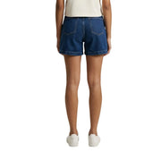 Dark blue cotton denim shorts for women by jacqueline de yong with rolled cuffs and back pockets shown from the back