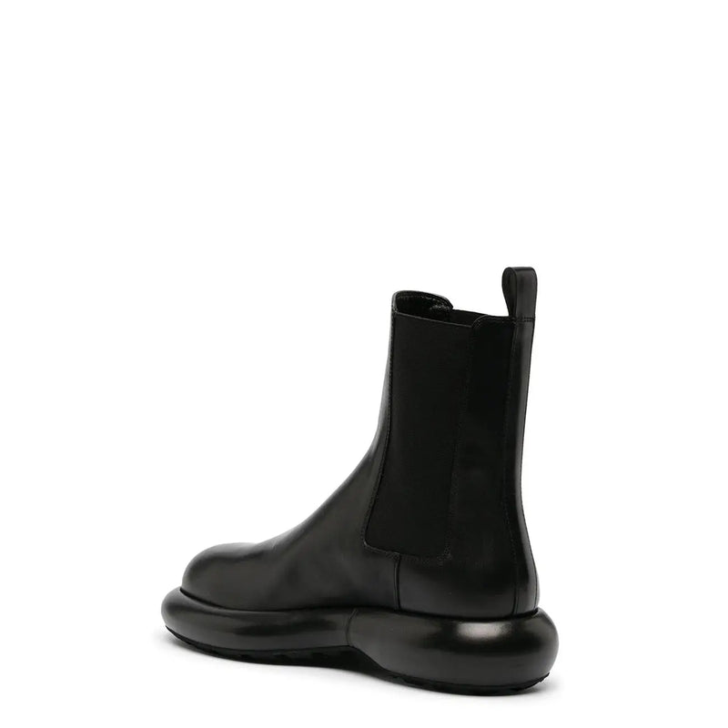 Jil Sander men black leather chelsea ankle boot with chunky glossy rubber sole and elastic side panels fall winter collection