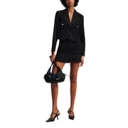 Black leather shoulder bag with blue accents and silver hardware paired with Karl Lagerfeld Jeans womens long black blazer for fall winter