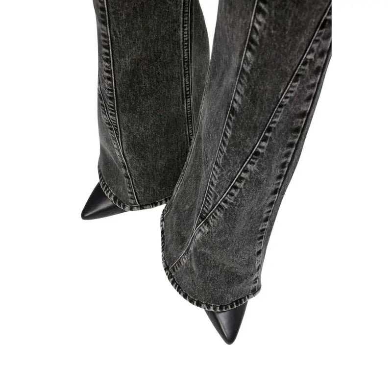 Karl Lagerfeld women’s black cotton jeans paired with black denim boots featuring pointed toes and stitching details