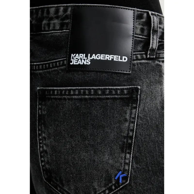Black denim jeans with black leather karl lagerfeld patch and blue embroidered logo on pocket made from organic cotton