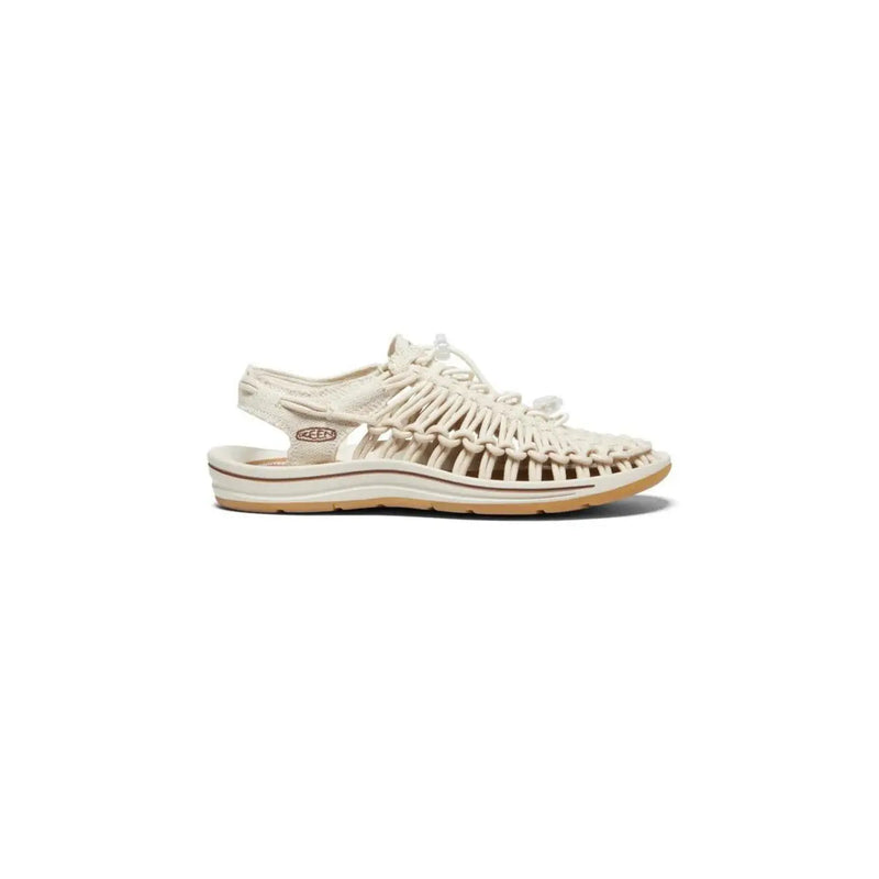 Keen women beige sandals slip on flat with cream-colored woven leather braided design and tan rubber sole