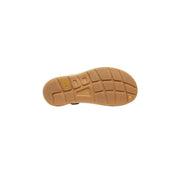 Tan rubber sole with textured grid pattern and yellow Keen logo on the back side of keen women beige sandals slip on flat rubber canvas