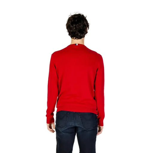 Red crew neck sweater with ribbed cuffs and hem, likely made of cotton or wool.