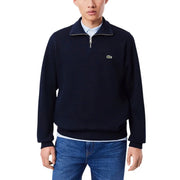 Marineblauer Lacoste Herren-Baumwollpullover mit halbem Reißverschluss und grünem Krokodillogo auf der Brust für die Freizeit.