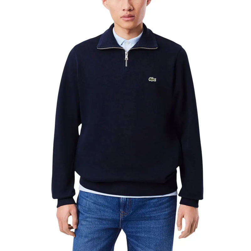Marineblauer Lacoste Herren-Baumwollpullover mit halbem Reißverschluss und grünem Krokodillogo auf der Brust für die Freizeit.