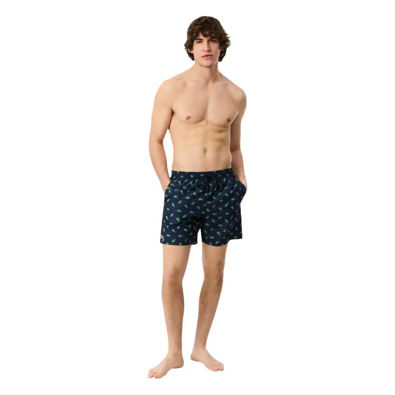 Dunkelblaue Lacoste Herren-Badehose aus Polyester mit hellgrünem Palmenmuster, Polyester-Shorts MH1851