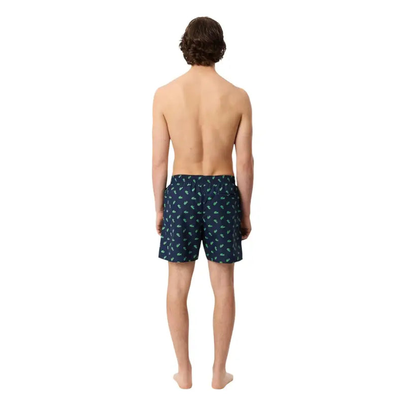 Lacoste Herren-Badeshorts aus Polyester mit blauem Print, dunkelblauer Stoff mit hellgrünem Palmenmuster