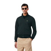 Grüner Lacoste Herren-Hoodie aus Baumwolle mit Reißverschluss, dunkelgrüner Farbe und dezentem, gesticktem Krokodil-Logo auf der Brust