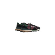 Lacoste Herren-Sneaker aus Leder, Modell Bordeaux Elite Active, in Dunkelburgunderrot und Schwarz mit grünen Akzenten und strukturiertem Obermaterial.