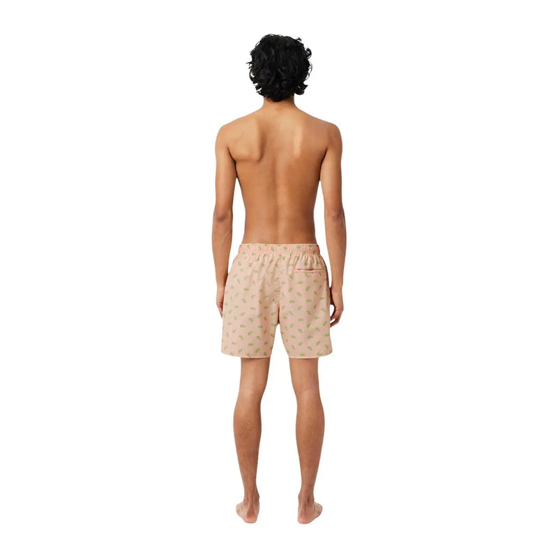 Beige lacoste men pink print polyester swimwear shorts with subtle green leaf pattern and elastic waistband