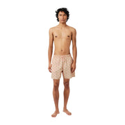 Lacoste men pink polyester swimwear shorts featuring a subtle repeating pattern of small green and yellow pineapples