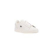 White lacoste sneakers with gold accents and crocodile logo.