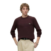 Lacoste Wollpullover für Herren in Bordeauxrot mit gesticktem Krokodillogo auf der linken Brust, Vorderansicht