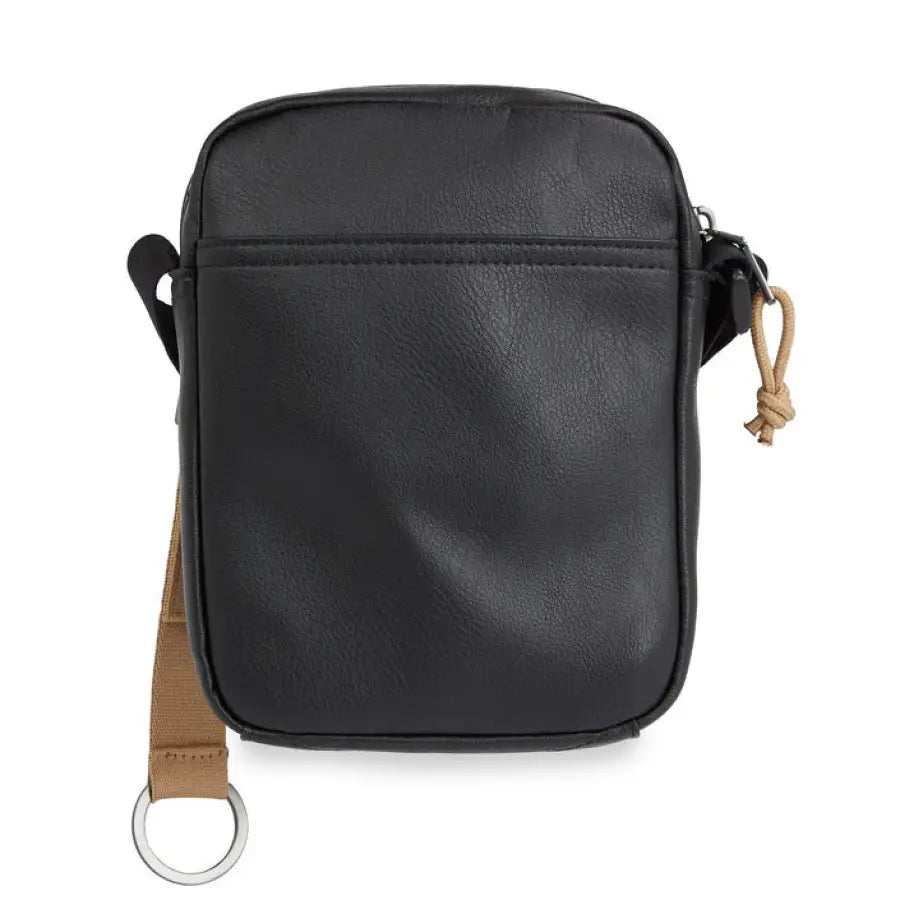 
                      
                        Calvin Klein black leather camera bag showcasing urban style fashion
                      
                    