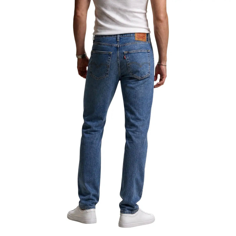 Back side of levi’s men jeans blue classic fit denim with cotton lyocell blend and brown leather patch waistband