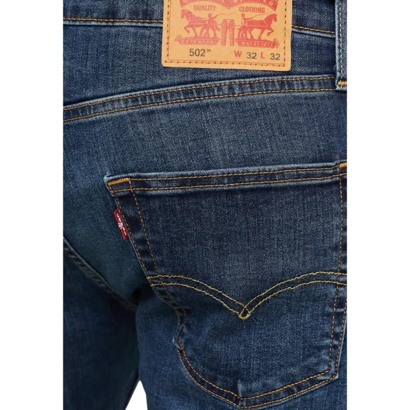 502 levi’s jeans in dark blue, made of denim material with a classic fit and iconic horse logo.