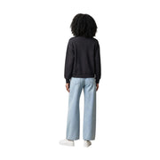 Levis women black cotton sweatshirt with round neck long sleeves relaxed fit and ribbed cuffs visible on the front