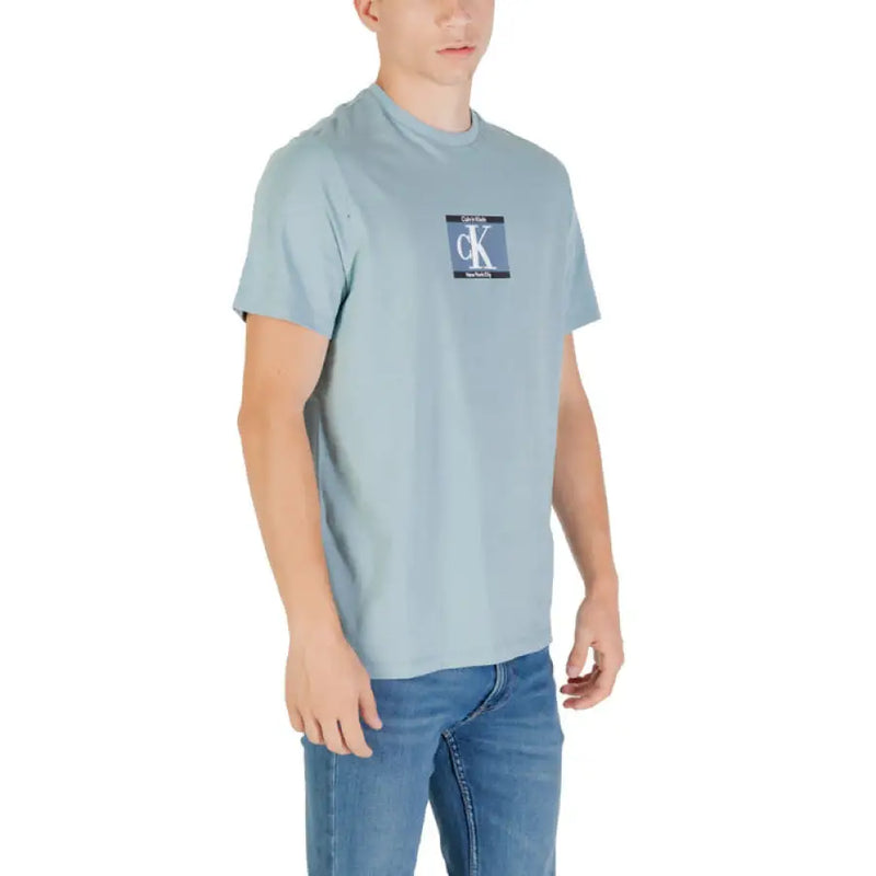 Light blue Calvin Klein T shirt displayed in a product image