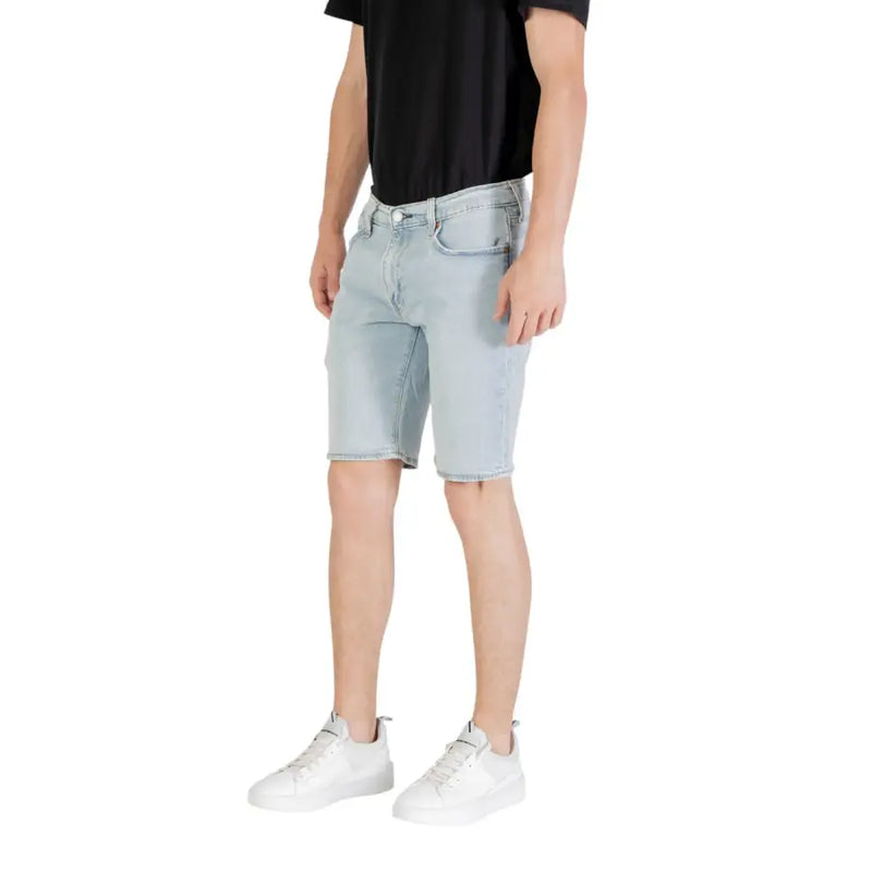 Light blue denim shorts displayed on a model for the product Light Blue Denim Shorts