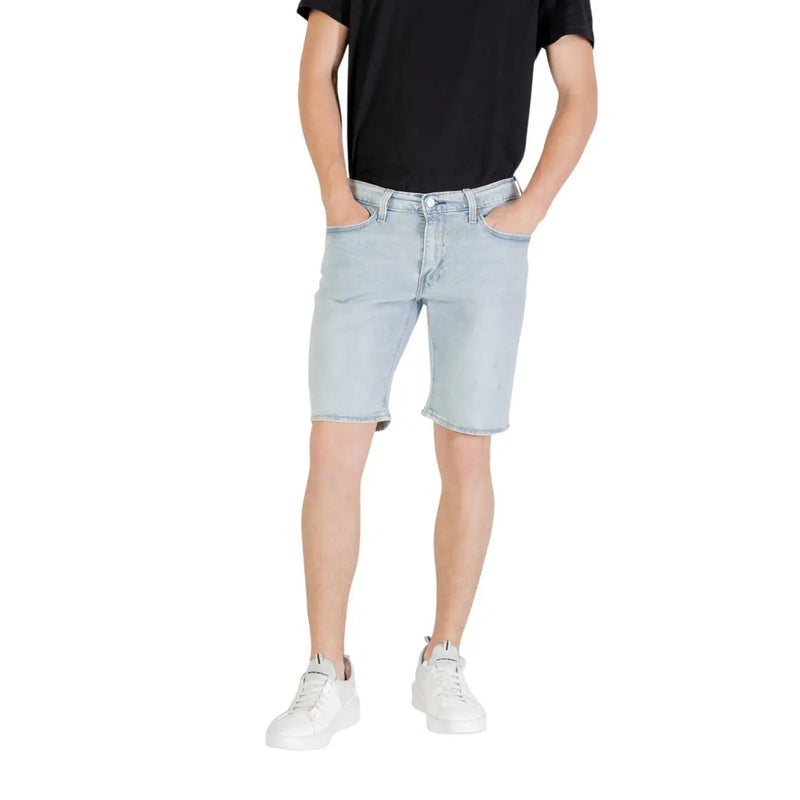 Light blue denim shorts with a classic five-pocket design and frayed hem in light-wash denim material