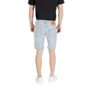 Light blue denim shorts with light-wash fabric classic levi’s design and brown leather patch at the waistband back side view