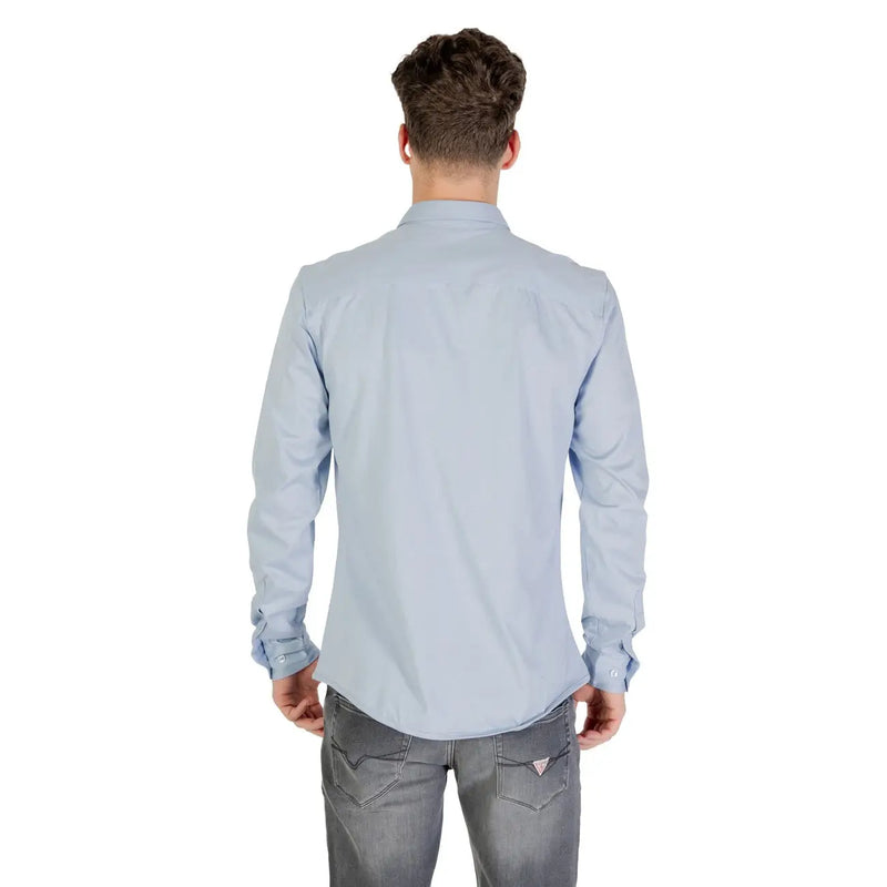 Light blue long sleeved dress shirt with classic collar and buttoned cuffs made of soft breathable fabric