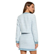 Light blue polyester blazer with round neck and buttons featuring classic check tweed and denim trim at cuffs and hem